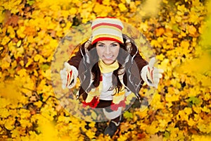 Happy smiling girl in autumn park