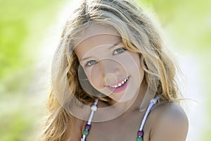 Happy smiling girl portrait green outdoor