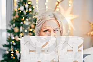 Happy smiling girl woman with christmas gift box. Christmas atmosphere
