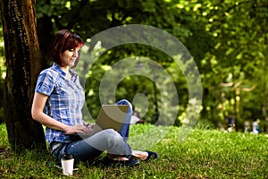 Happy smiling girl working online.