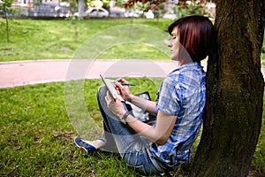 Happy smiling girl working online.