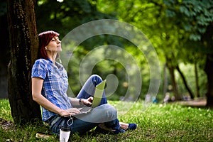 Happy smiling girl working online.