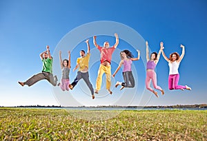 Happy smiling group of jumping people