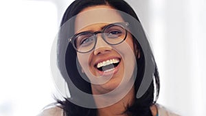 Happy smiling indian young woman in glasses