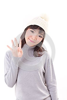 Happy, smiling, joyful woman wearing knit hat, showing 4 fingers