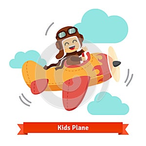 Happy smiling kid flying plane like a real pilot