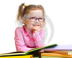 Happy smiling kid girl in glasses reading books