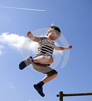 Happy smiling kid jumping