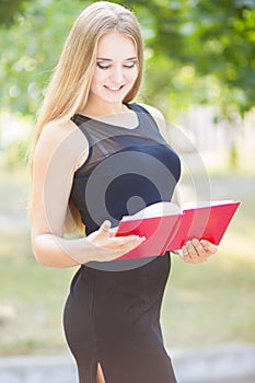 Happy smiling lady reading book