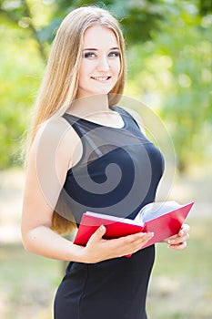 Happy smiling lady reading book