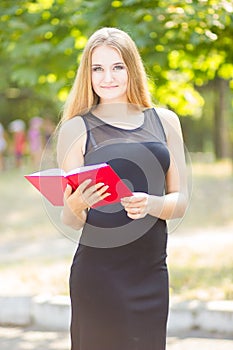 Happy smiling lady reading book