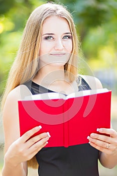 Happy smiling lady reading book