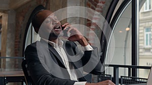 Happy smiling laughing African American positive ethnic man business employer entrepreneur smile pleasant conversation