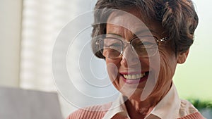 Happy smiling laughing joyful Caucasian old woman reading good news female retired lady senior granny mature grandmother