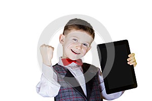 Happy smiling little boy holding tablet