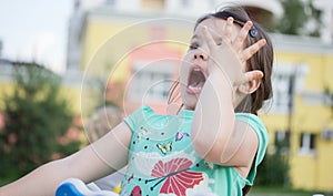 Happy smiling little girl on playground