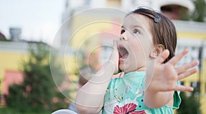 Happy smiling little girl on playground