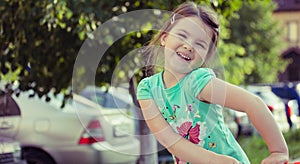 Happy smiling little girl on playground