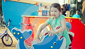 Happy smiling little girl on playground