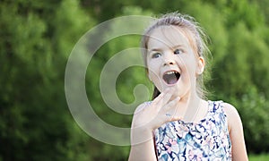 Happy smiling little girl on playground