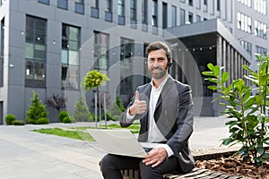 Happy and smiling male entrepreneur looking at camera with video headset, positive support in critical situation, those support,