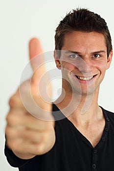 Happy smiling man doing two thumbs up