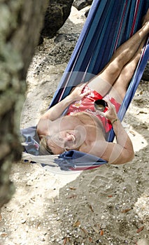 Happy smiling man in hammock