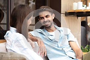 Happy smiling man having good conversation with young woman