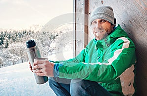 Happy smiling man portrait with hot drink