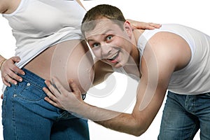 Happy smiling man with pregnant woman isolated