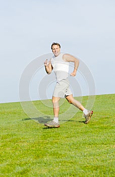 Happy smiling man running.