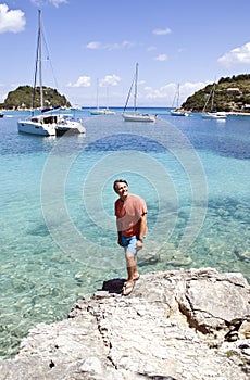 A happy smiling man on vacation in Greece.