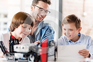 Happy smiling man in workshop photo