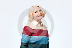 Happy smiling mature blonde woman in her sixties