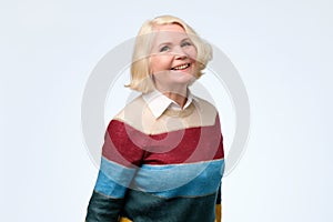 Happy smiling mature blonde woman in her sixties