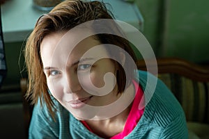 Happy smiling middle aged woman, forty years old. Ordinary woman without make-up at home