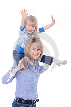 Happy smiling mom with child on shoulders