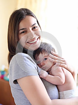Happy smiling mother with baby