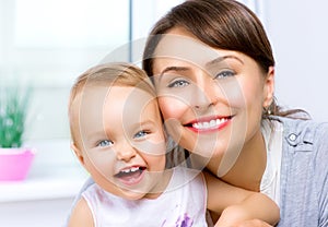 Happy Smiling Mother and Baby