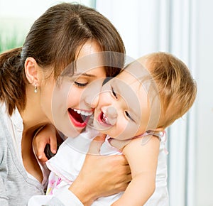 Happy Smiling Mother and Baby