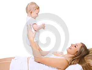 Happy smiling mother and baby having fun together