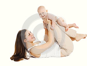 Happy smiling mother playing with baby on white