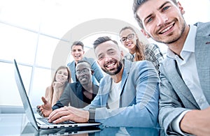 Happy smiling multi-ethnic creative millennial team excited by online result or growth