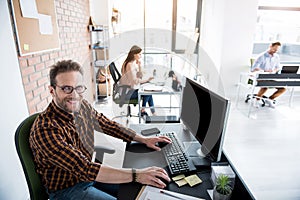 Happy smiling office worker in room