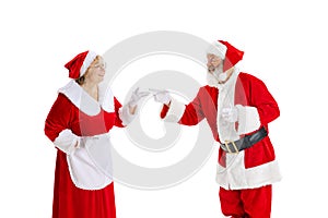 Happy smiling old man in Santa Claus costume and cute elder woman, missis Claus talking isolated on white background.