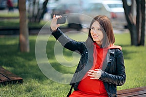 Happy Smiling Pregnant Woman Taking a Selfie