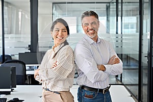 Happy smiling professional diverse executives team standing in office, portrait.