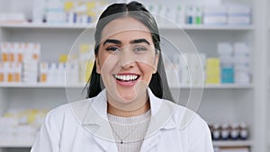 Happy smiling professional female pharmacist in pharmacy. Medical chemist happy with successful treatment of sick