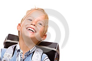 Happy smiling pupil (boy) with satchel