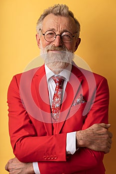 Happy smiling senior executive businessman in fashionable red suit with necktie.